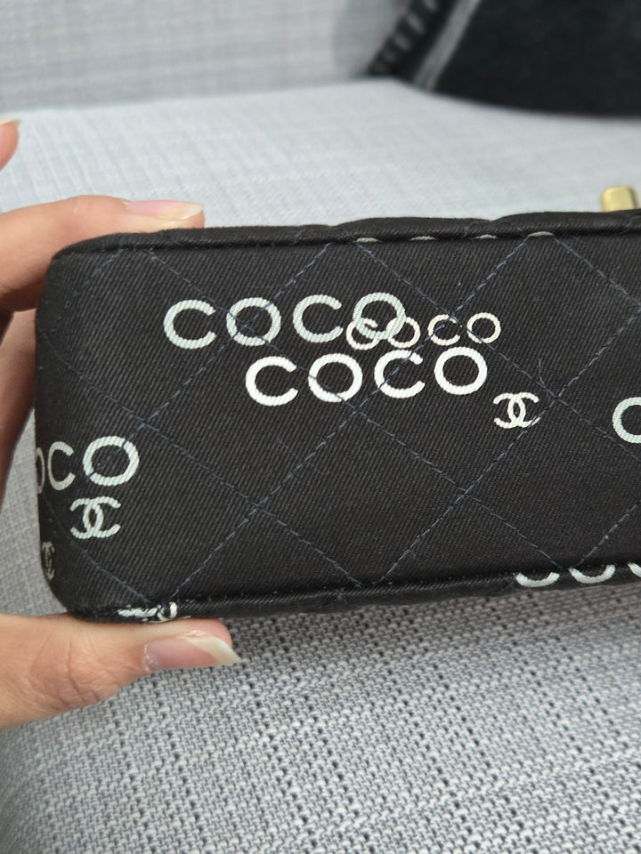 Chanel series 7 2002/2003 Black Canvas Quilted “COCO” Medium Classic Flap Light Gold Hardware