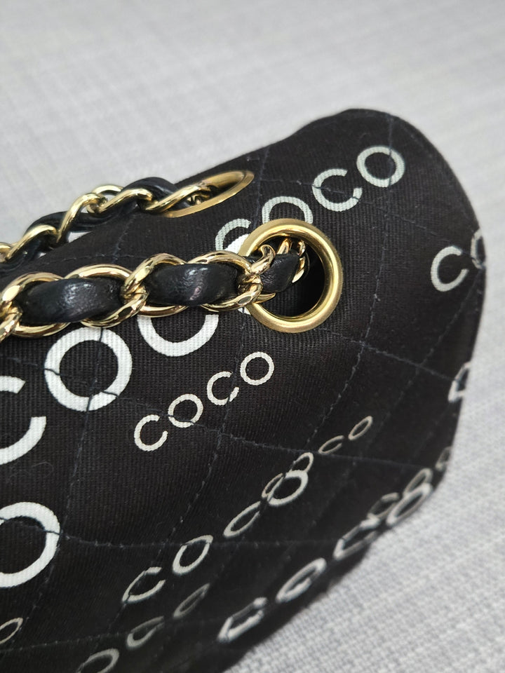 Chanel series 7 2002/2003 Black Canvas Quilted “COCO” Medium Classic Flap Light Gold Hardware