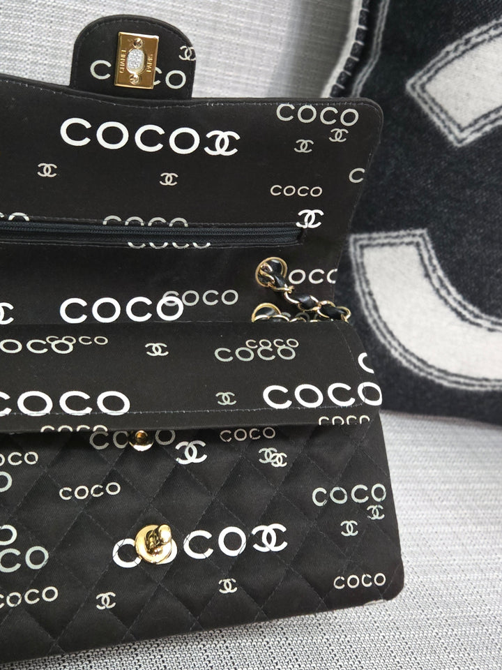 Chanel series 7 2002/2003 Black Canvas Quilted “COCO” Medium Classic Flap Light Gold Hardware