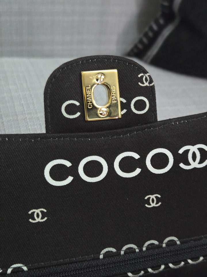 Chanel series 7 2002/2003 Black Canvas Quilted “COCO” Medium Classic Flap Light Gold Hardware