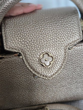 Load image into Gallery viewer, LOUIS VUITTON LV Metallic Taurillon Embellished Flower Crown Mini Capucines in Gold
