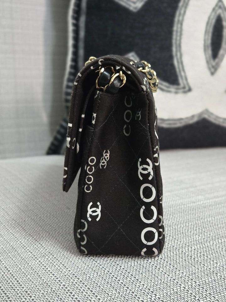 Chanel series 7 2002/2003 Black Canvas Quilted “COCO” Medium Classic Flap Light Gold Hardware