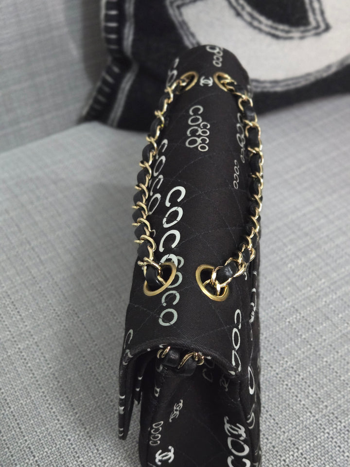 Chanel series 7 2002/2003 Black Canvas Quilted “COCO” Medium Classic Flap Light Gold Hardware