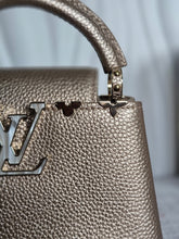Load image into Gallery viewer, LOUIS VUITTON LV Metallic Taurillon Embellished Flower Crown Mini Capucines in Gold
