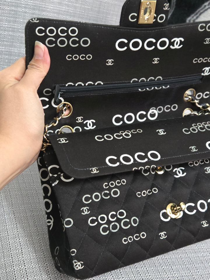 Chanel series 7 2002/2003 Black Canvas Quilted “COCO” Medium Classic Flap Light Gold Hardware