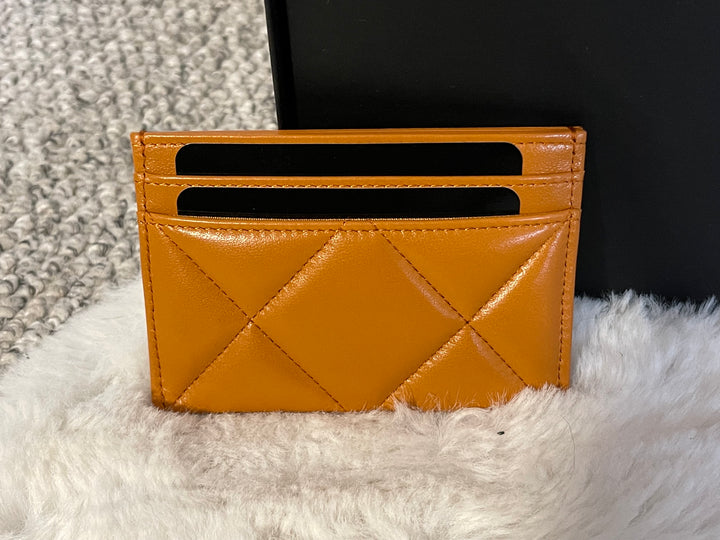 Chanel 19 Flat card holder in 21A Pumpkin spice Lambskin mixed hardware
